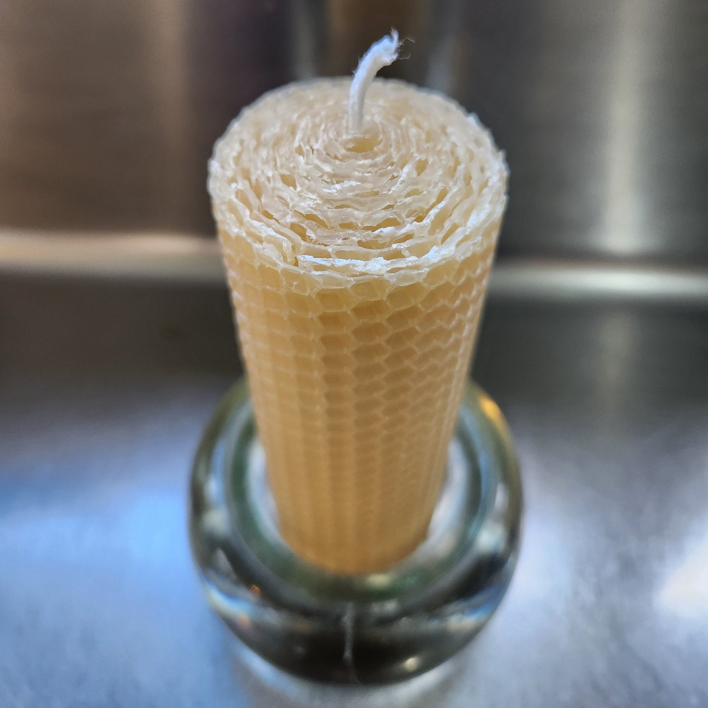 hand rolled beeswax candle in glass holder